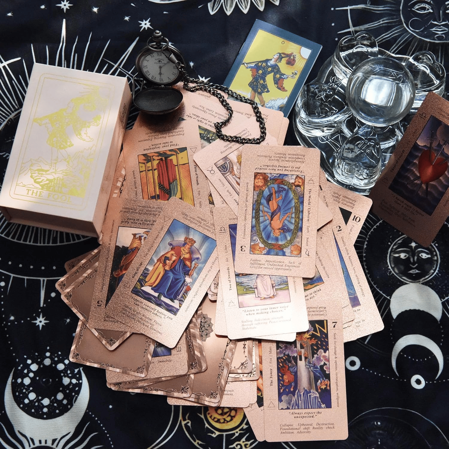 The Witch's Cauldron Rose Gold Tarot Card Set includes a guide booklet and is suitable for beginners. It features information on chakras, planets, zodiac signs, elements, and affirmations.
