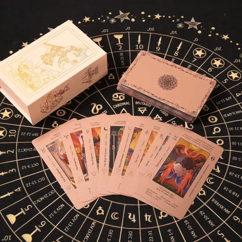 The Witch's Cauldron Rose Gold Tarot Card Set includes a guide booklet and is suitable for beginners. It features information on chakras, planets, zodiac signs, elements, and affirmations.