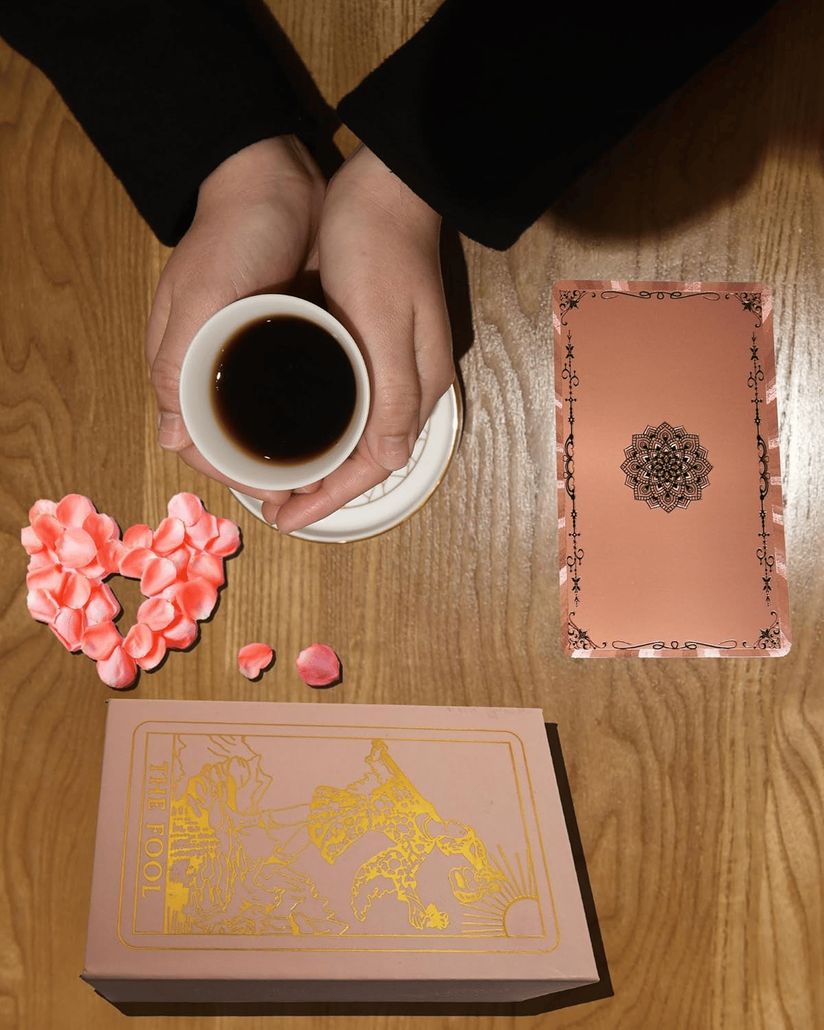 The Witch's Cauldron Rose Gold Tarot Card Set includes a guide booklet and is suitable for beginners. It features information on chakras, planets, zodiac signs, elements, and affirmations.